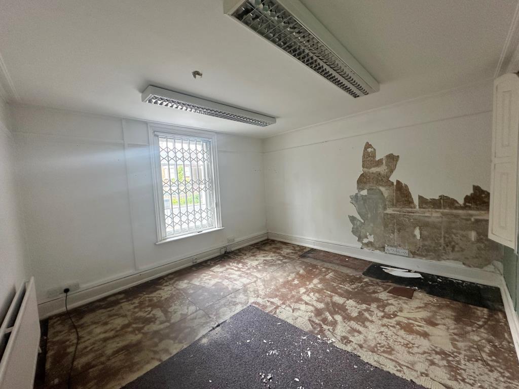 Lot: 8 - DETACHED PROPERTY FOR CONVERSION INTO FOUR-BEDROOM HOUSE - Ground floor room to front